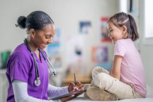 pediatric provider and child at family medicine clinic