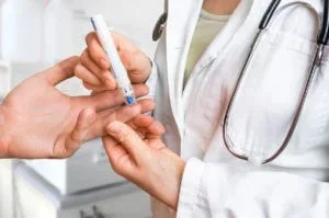 A patient receives a glucose check as part of diabetes management at Abundance Health Care, a family medicine clinic near you in Colorado Springs