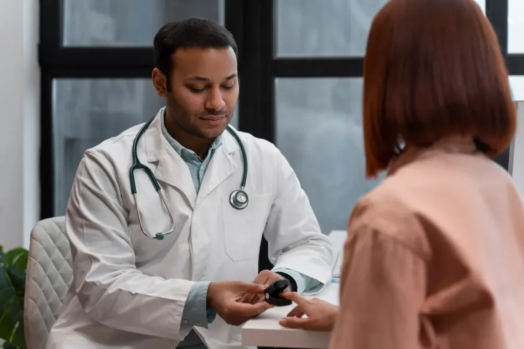 Doctor checking a patient's vitals with a pulse oximeter during a preventive health screening
