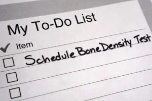 A handwritten to-do list reminder to schedule a bone density test, a screening Abundance Health Care offers in Colorado Springs