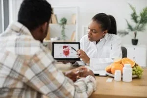 A doctor reviews a personalized weight loss and nutrition plan with a patient