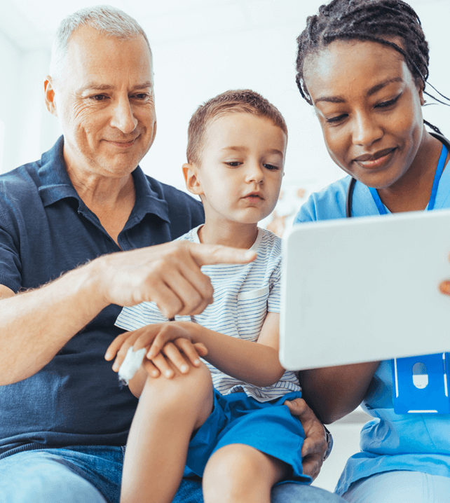 family medicine physician showing a chart to dad and his son