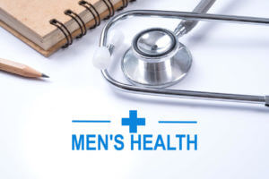 Stethoscope, notebook and pencil with men's health